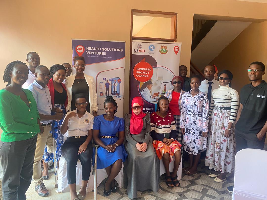 Instructor demonstrating digital health tools to PWD participants